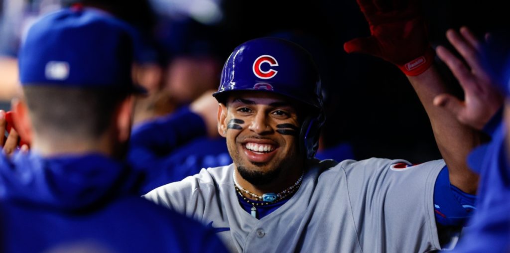 Christopher Morel smiles in the Cubs dugout.