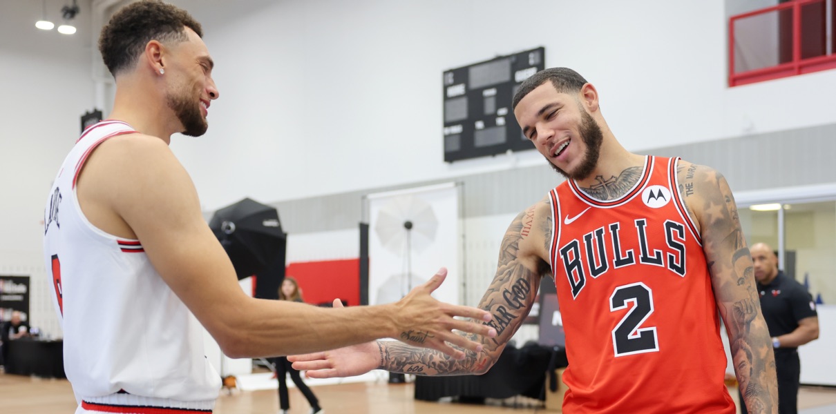Lonzo Ball and Zach LaVine of the Chicago Bulls embrace at 2023 Media Day.