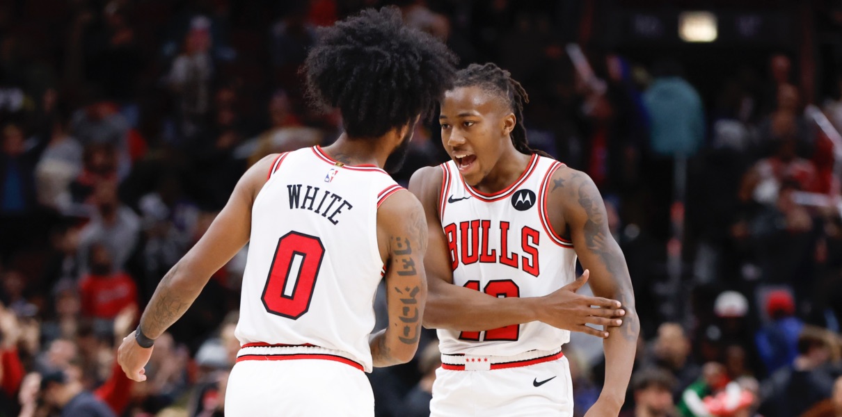 Coby White celebrated with Ayo Dosunmu of the Chicago Bulls