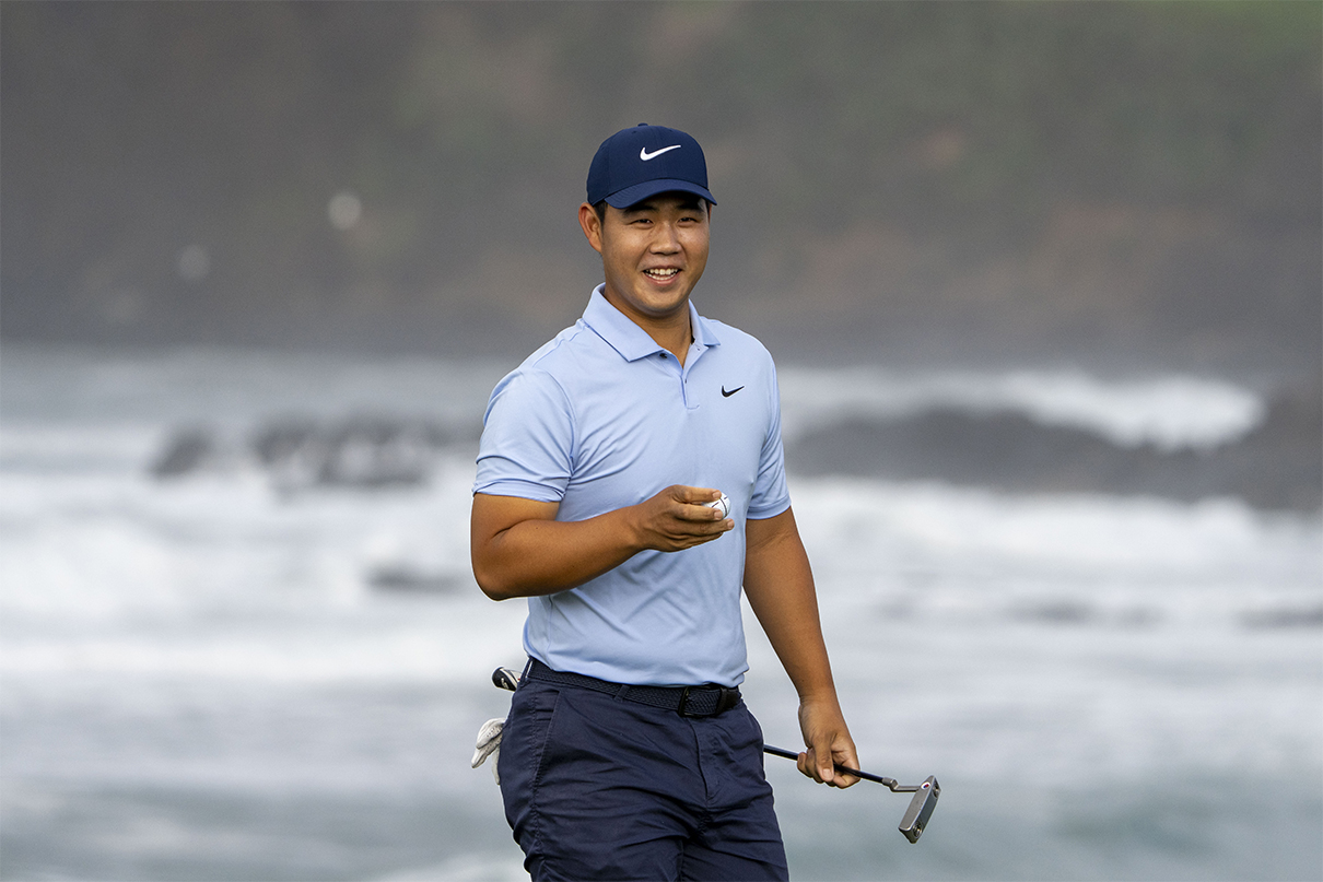 February 1, 2024; Pebble Beach, California, USA; Tom Kim smiles after making his putt on the 10th hole during the 10th round of the AT&T Pebble Beach Pro-Am golf tournament at Pebble Beach Golf Links. 