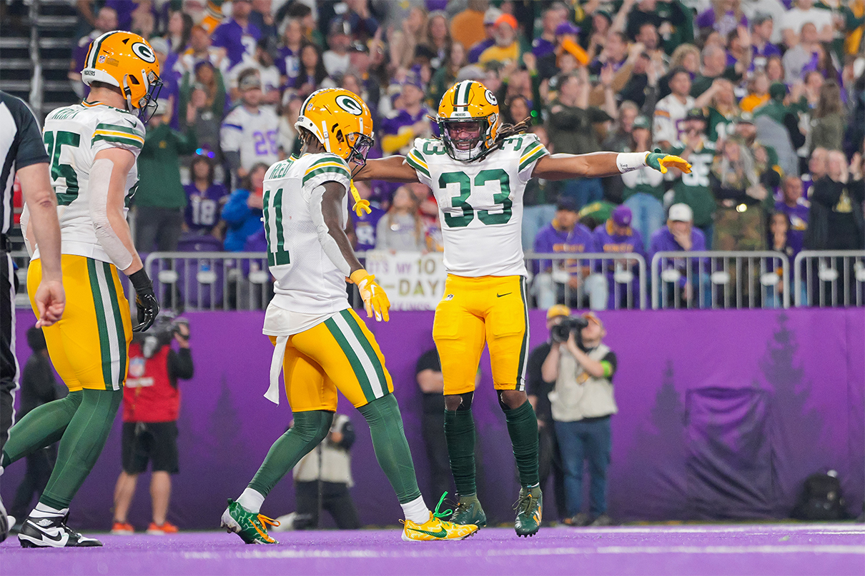 Dec 31, 2023; Minneapolis, Minnesota, USA; Green Bay Packers wide receiver Jayden Reed (11) celebrates his touchdown with running back Aaron Jones (33) against the Minnesota Vikings in the first quarter at U.S. Bank Stadium. Mandatory Credit: Brad Rempel-USA TODAY Sports