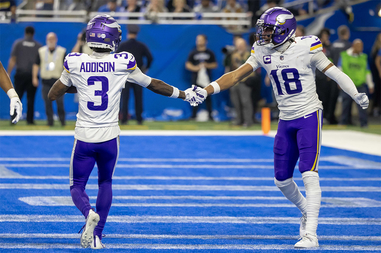 Jan 7, 2024; Detroit, Michigan, USA; Minnesota Vikings wide receiver Jordan Addison (3) catches a pass for a touchdown and celebrates with wide receiver Justin Jefferson (18) during second half of the game against the Detroit Lions at Ford Field. Mandatory Credit: David Reginek-USA TODAY Sports