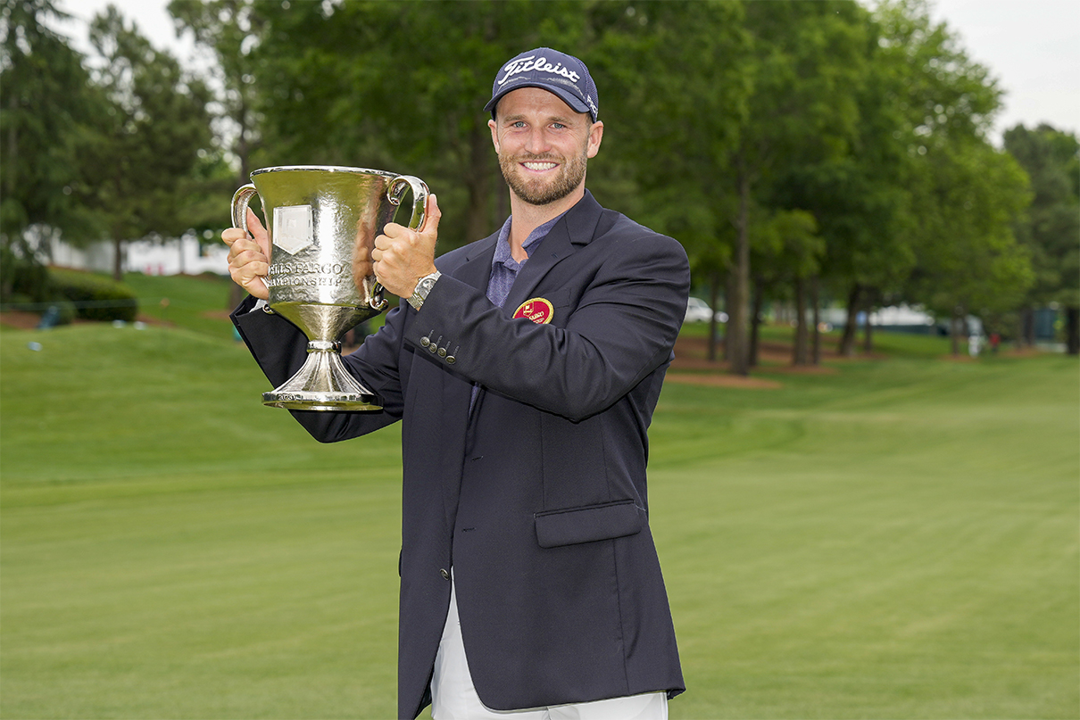 May 7, 2023; Charlotte, North Carolina, USA; Wyndham Clark hoists his trophy after his win during the final round of the Wells Fargo Championship golf tournament. His 2024 Wells Fargo Championship Odds are +1600. Mandatory Credit: Jim Dedmon-USA TODAY Sports