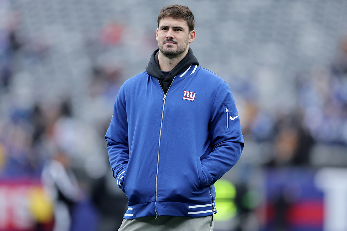 Dec 31, 2023; East Rutherford, New Jersey, USA; New York Giants injured quarterback Daniel Jones (8) watches warm ups before a game against the Los Angeles Rams at MetLife Stadium. Mandatory Credit: Brad Penner-USA TODAY Sports