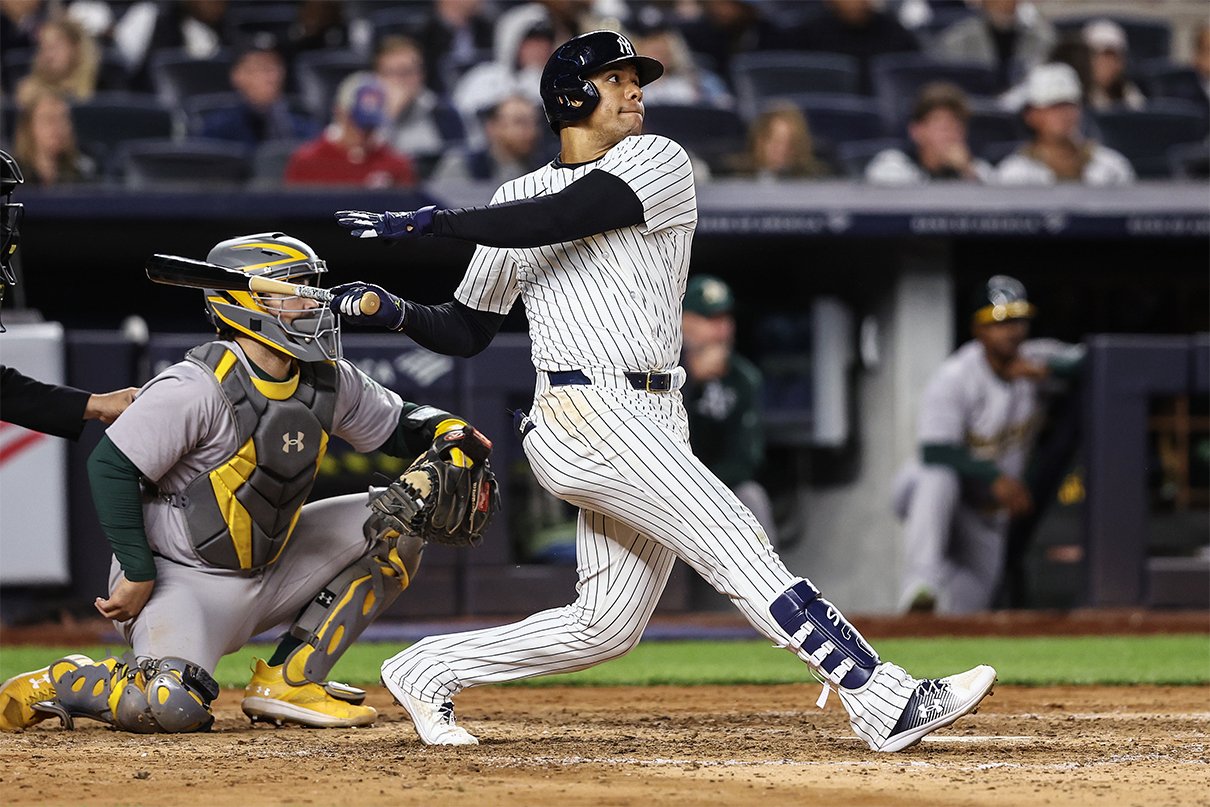 Apr 24, 2024; Bronx, New York, USA; New York Yankees right fielder Juan Soto (22) hits a solo home run in the sixth inning against the Oakland Athletics at Yankee Stadium. Mandatory Credit: Wendell Cruz-USA TODAY Sports