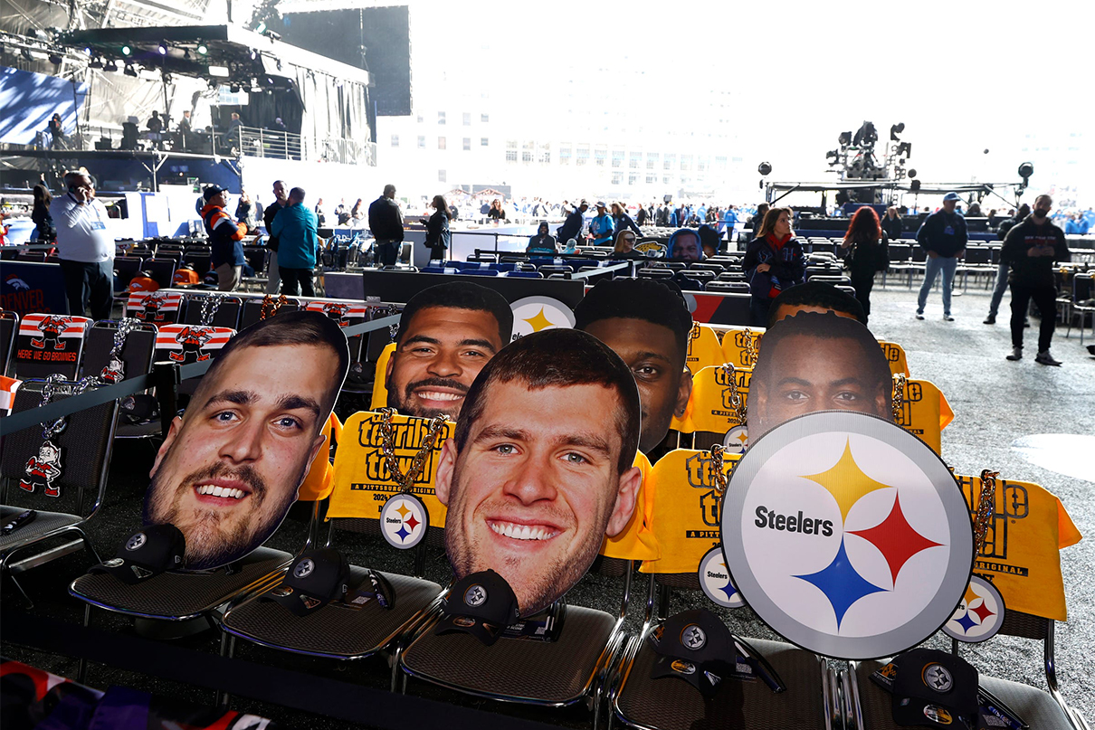 Oversized pictures of Pittsburgh Steelers players sit in the seats of Steeler fans who will be inside the NFL draft theater in the background before the start of the 2024 NFL draft in Detroit on Thursday, April 25, 2024; Eric Seals / USA TODAY NETWORK