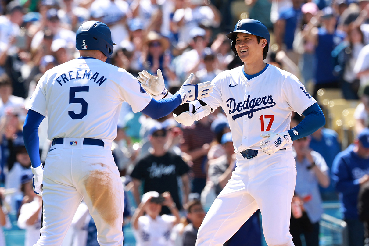 May 5, 2024; Los Angeles, California, USA;  Los Angeles Dodgers designated hitter Shohei Ohtani (17) is greeted by first base Freddie Freeman (5) after hitting a home run during the eighth inning against the Atlanta Braves at Dodger Stadium. Mandatory Credit: Kiyoshi Mio-USA TODAY Sports